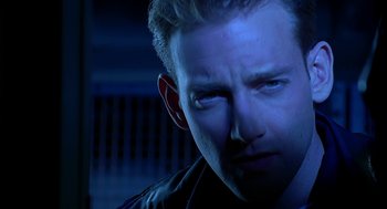 Movie still from “Bride of Chucky” (1998), directed by Ronny Yu – A man's face in the dark; Close Up shot, Low angle