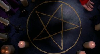 Movie still from “Bride of Chucky” (1998), directed by Ronny Yu – A pentagram drawn on the floor of a room; Extreme Close Up shot, Overhead angle