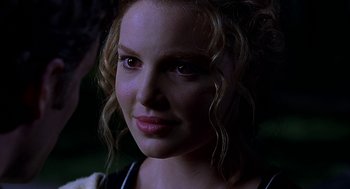Movie still from “Bride of Chucky” (1998), directed by Ronny Yu – A person with curly hair; Close Up shot, Over the shoulder angle