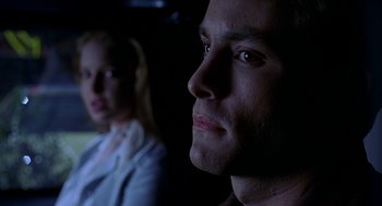 Movie still from “Bride of Chucky” (1998), directed by Ronny Yu – A man and a woman looking into the distance; Close Up shot, Low angle