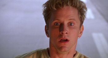 Movie still from “Bride of Chucky” (1998), directed by Ronny Yu – A person with a surprised look on his face; Close Up shot, Low angle