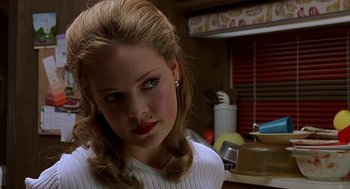 Movie still from “Bride of Chucky” (1998), directed by Ronny Yu – A person wearing a white shirt; Close Up shot, Over the shoulder angle