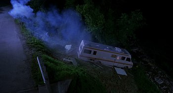 Movie still from “Bride of Chucky” (1998), directed by Ronny Yu – An ambulance is sitting on the side of a road; Extreme Wide shot, Low angle