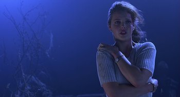 Movie still from “Bride of Chucky” (1998), directed by Ronny Yu – A beautiful young lady posing for a picture; Medium shot, Low angle