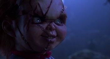 Movie still from “Bride of Chucky” (1998), directed by Ronny Yu – A chucky doll's face; Close Up shot, Low angle