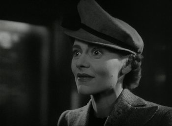 Movie still from “Brief Encounter” (1945), directed by David Lean – An old photo of a woman wearing a hat; Close Up shot, Low angle