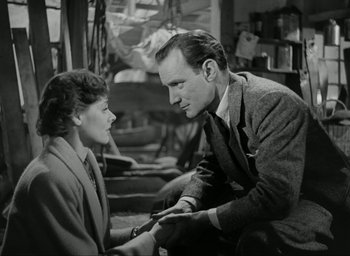 Movie still from “Brief Encounter” (1945), directed by David Lean – A man and a woman sitting in a room; Medium shot, Low angle