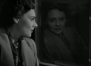 Movie still from “Brief Encounter” (1945), directed by David Lean – A black and white photo of a woman looking out of a window; Close Up shot, Over the shoulder angle