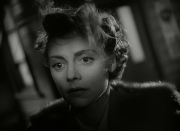Movie still from “Brief Encounter” (1945), directed by David Lean – A black and white photo of a woman in a fur coat; Close Up shot, Low angle