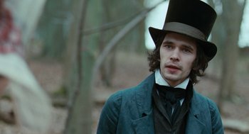 Movie still from “Bright Star” (2009), directed by Jane Campion – A man wearing a top hat in a forest; Close Up shot, Over the shoulder angle