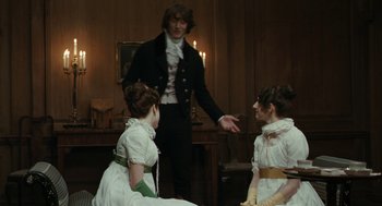 Movie still from “Bright Star” (2009), directed by Jane Campion – A man and two women dressed in period clothing; Wide shot, Low angle