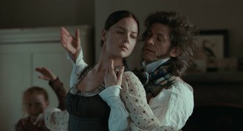 Movie still from “Bright Star” (2009), directed by Jane Campion – A man and a woman are dancing in a room; Medium shot, Over the shoulder angle