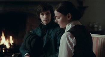 Movie still from “Bright Star” (2009), directed by Jane Campion – A man and a woman standing next to each other; Medium shot, Over the shoulder angle