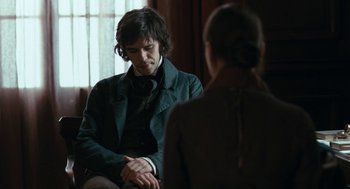 Movie still from “Bright Star” (2009), directed by Jane Campion – A man and a woman sitting in front of each other; Medium shot, Over the shoulder angle