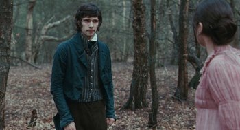 Movie still from “Bright Star” (2009), directed by Jane Campion – A man standing in the middle of a forest; Medium shot, Over the shoulder angle