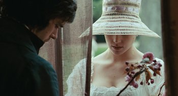 Movie still from “Bright Star” (2009), directed by Jane Campion – A woman wearing a hat standing next to a man; Close Up shot, Over the shoulder angle