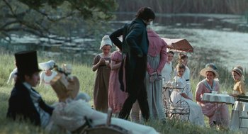 Movie still from “Bright Star” (2009), directed by Jane Campion – A group of people standing in the grass; Wide shot, High angle