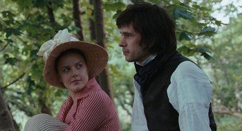 Movie still from “Bright Star” (2009), directed by Jane Campion – A man and a woman standing next to each other in front of trees; Medium shot, Over the shoulder angle