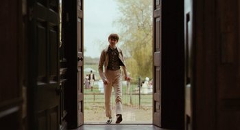 Movie still from “Bright Star” (2009), directed by Jane Campion – A young man walking through an open doorway; Wide shot, Over the shoulder angle