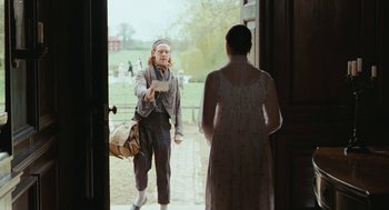 Movie still from “Bright Star” (2009), directed by Jane Campion – A man and a woman standing in front of an open door; Medium shot, Over the shoulder angle