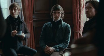 Movie still from “Bright Star” (2009), directed by Jane Campion – A man sitting on a chair in front of a window; Medium shot, Over the shoulder angle