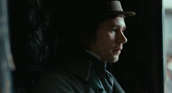 Movie still from “Bright Star” (2009), directed by Jane Campion – A man wearing a hat and a suit; Close Up shot, Over the shoulder angle
