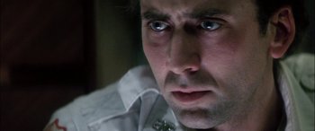 Movie still from “Bringing Out the Dead” (1999), directed by Martin Scorsese – A man's eyes and face; Close Up shot, Low angle