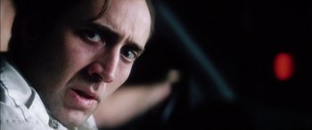 Movie still from “Bringing Out the Dead” (1999), directed by Martin Scorsese – A man's face as he drives a car; Close Up shot, Low angle