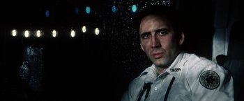 Movie still from “Bringing Out the Dead” (1999), directed by Martin Scorsese – A person wearing a shirt and a tie; Close Up shot, Low angle