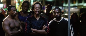 Movie still from “Bringing Out the Dead” (1999), directed by Martin Scorsese – A group of men standing next to each other; Medium shot, Low angle