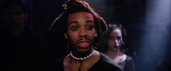 Movie still from “Bringing Out the Dead” (1999), directed by Martin Scorsese – A man with dreadlocks is looking at the camera; Close Up shot, Low angle