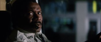 Movie still from “Bringing Out the Dead” (1999), directed by Martin Scorsese – A person wearing a tie in the dark; Close Up shot, Low angle