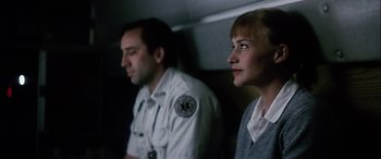 Movie still from “Bringing Out the Dead” (1999), directed by Martin Scorsese – A man and a woman sitting next to each other; Close Up shot, Low angle