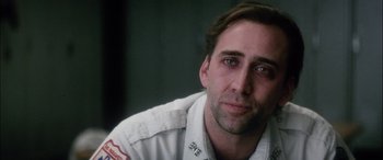 Movie still from “Bringing Out the Dead” (1999), directed by Martin Scorsese – A person wearing a white shirt; Close Up shot, Over the shoulder angle