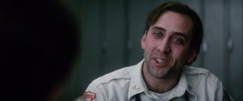 Movie still from “Bringing Out the Dead” (1999), directed by Martin Scorsese – A person wearing a uniform; Close Up shot, Over the shoulder angle