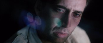 Movie still from “Bringing Out the Dead” (1999), directed by Martin Scorsese – A man's face in a dark room; Extreme Close Up shot, Low angle