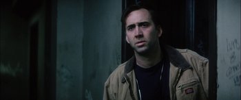 Movie still from “Bringing Out the Dead” (1999), directed by Martin Scorsese – A man in a brown jacket is looking to his left; Close Up shot, Low angle