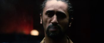 Movie still from “Bringing Out the Dead” (1999), directed by Martin Scorsese – A person with a beard; Close Up shot, Over the shoulder angle