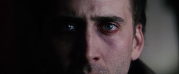 Movie still from “Bringing Out the Dead” (1999), directed by Martin Scorsese – A man's face with blue eyes; Extreme Close Up shot, Overhead angle