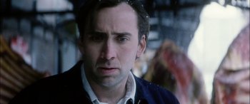 Movie still from “Bringing Out the Dead” (1999), directed by Martin Scorsese – A person wearing a jacket and looking sad; Close Up shot, Over the shoulder angle