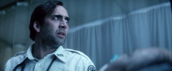 Movie still from “Bringing Out the Dead” (1999), directed by Martin Scorsese – A person wearing a uniform; Close Up shot, Over the shoulder angle