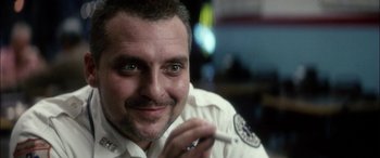 Movie still from “Bringing Out the Dead” (1999), directed by Martin Scorsese – A person wearing a white shirt; Close Up shot, Low angle