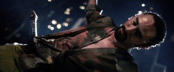 Movie still from “Bringing Out the Dead” (1999), directed by Martin Scorsese – View of a person's arm and shoulder; Close Up shot, Low angle