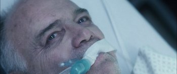 Movie still from “Bringing Out the Dead” (1999), directed by Martin Scorsese – A person with a tube in his mouth; Extreme Close Up shot, Overhead angle