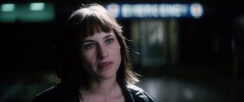 Movie still from “Bringing Out the Dead” (1999), directed by Martin Scorsese – A person wearing a black jacket; Close Up shot, Over the shoulder angle