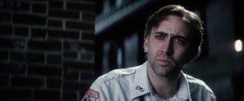 Movie still from “Bringing Out the Dead” (1999), directed by Martin Scorsese – A person wearing a uniform; Close Up shot, Low angle