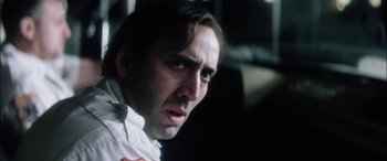 Movie still from “Bringing Out the Dead” (1999), directed by Martin Scorsese – A person wearing a white shirt; Close Up shot, Low angle