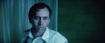 Movie still from “Bringing Out the Dead” (1999), directed by Martin Scorsese – A person wearing a uniform; Close Up shot, Over the shoulder angle