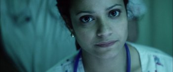 Movie still from “Bringing Out the Dead” (1999), directed by Martin Scorsese – A woman's face in a hospital bed; Close Up shot, Low angle