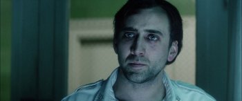 Movie still from “Bringing Out the Dead” (1999), directed by Martin Scorsese – A person wearing a white shirt; Close Up shot, Over the shoulder angle